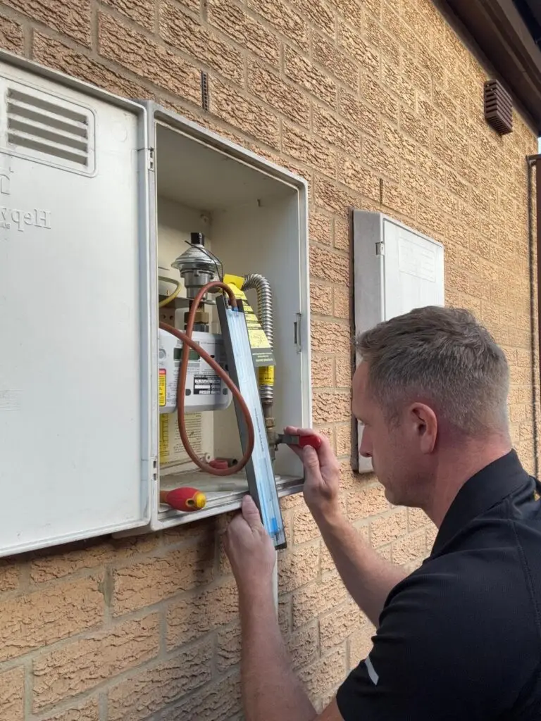 Michael carrying out a tightness test at a domestic gas meter